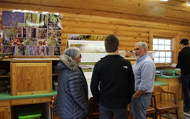 Professor Emeritus Kerry Rabenold talking with Donna Fekete (left) and Peter Hollenbeck (middle).